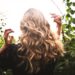 Blonde-haired Woman Standing Between Green Plants